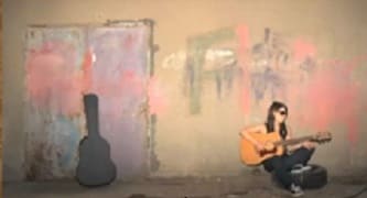 A woman with a guitar