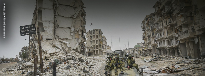 soldiers in the ruined and cities of Syria