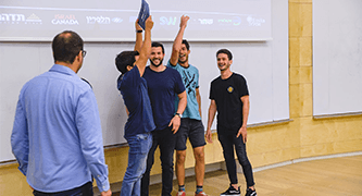 Students speaking on stage