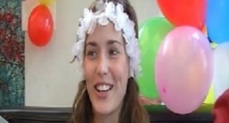 Woman with a bouquet of flowers and balloons