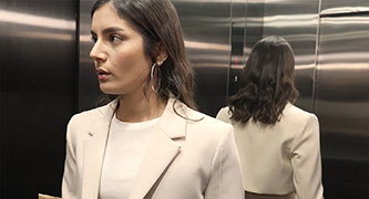A woman in an elevator