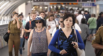 People walking at a train station