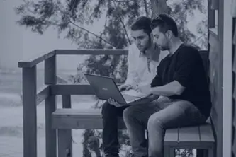 People on a black and white computer