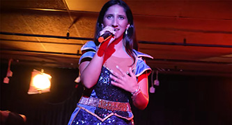 A woman singing on stage