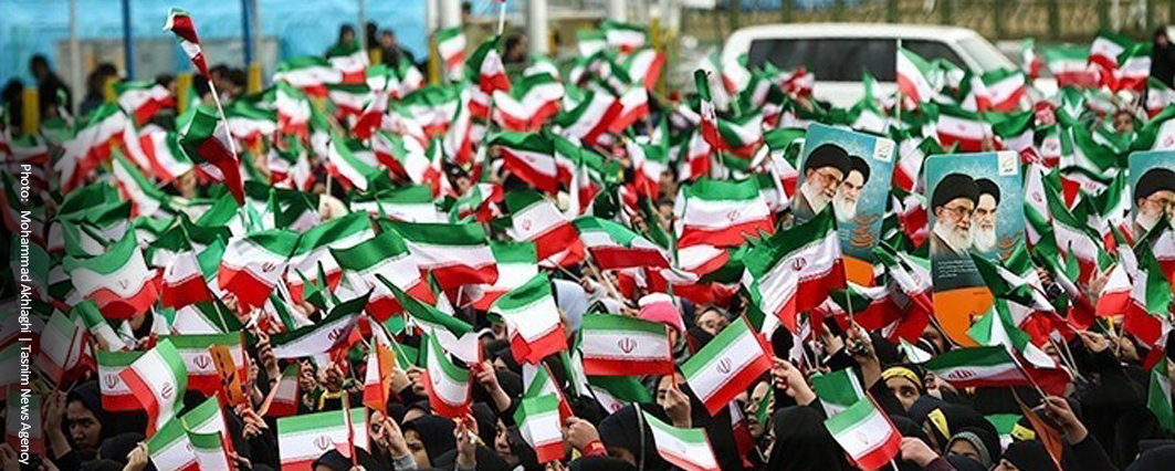 Many flags of Iran and pictures of Khamenei
